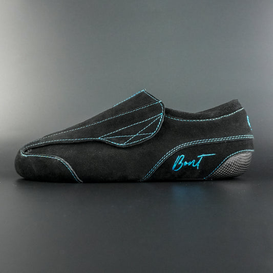 Side view of the Envy suede skate showing black suede finish