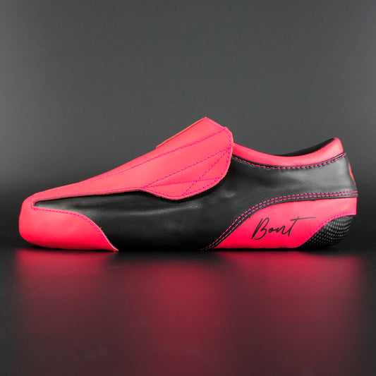 Side view of the Envy skate showing pink and black finish