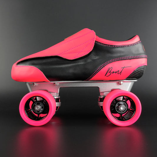 Side view of the Envy suede skate showing pink and black suede finish