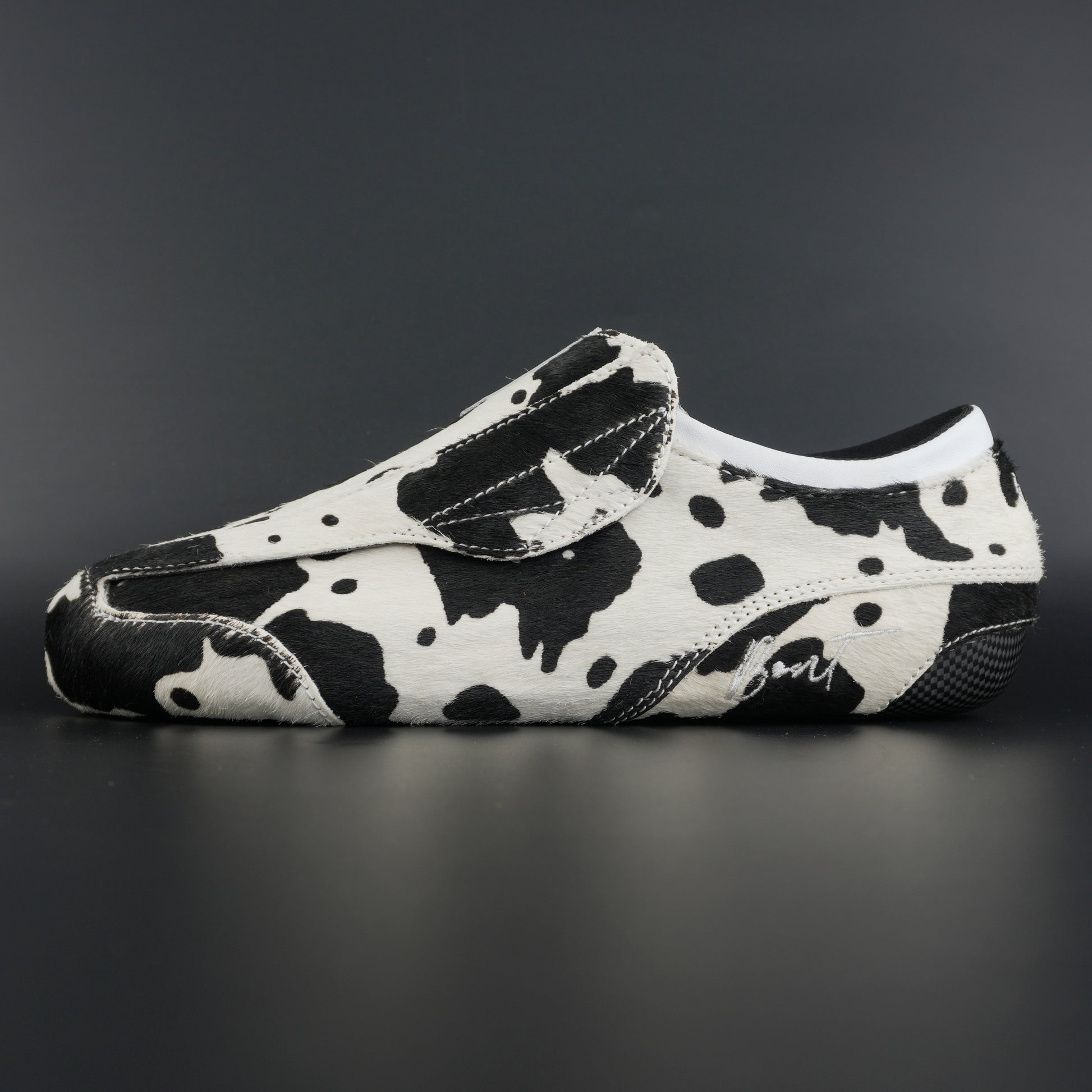 Side view of Envy Cow Skin Roller Skate showing cowhide pattern