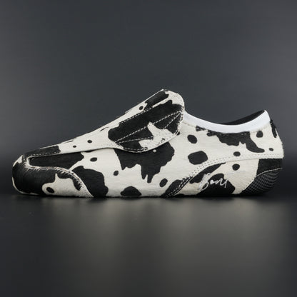 Side view of Envy Cow Skin Roller Skate showing cowhide pattern