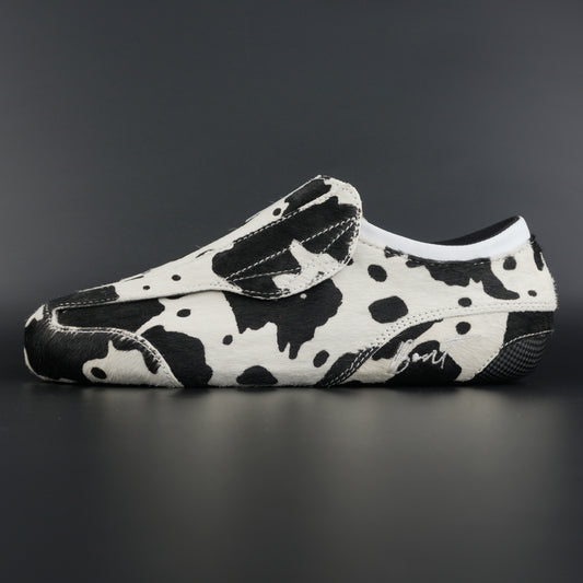 Side view of Envy Cow Skin Roller Skate showing cowhide pattern