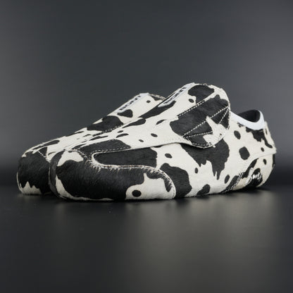 Angled view showing natural brown and white leather contrast