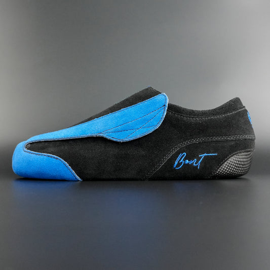 Side view of the Envy suede skate showing blue and black suede finish