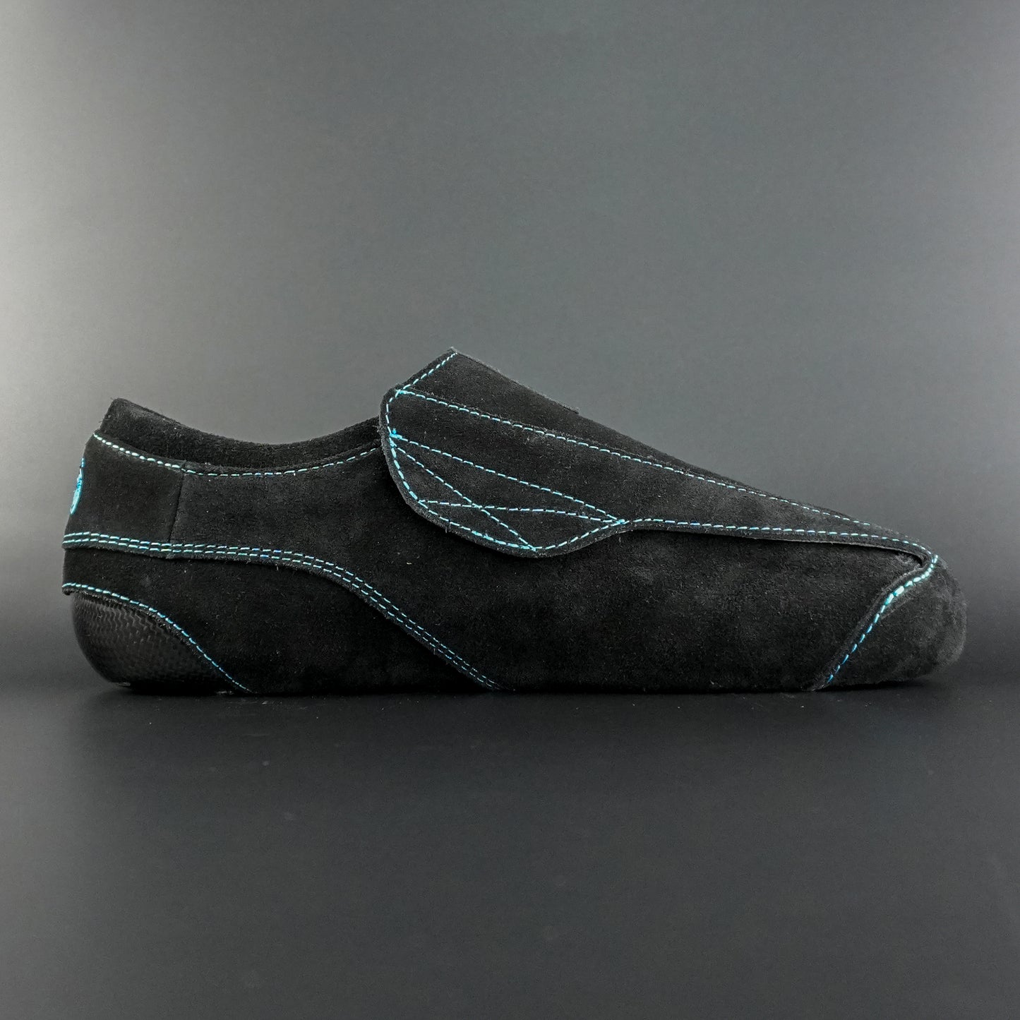Side view of the Envy suede skate showing black suede finish
