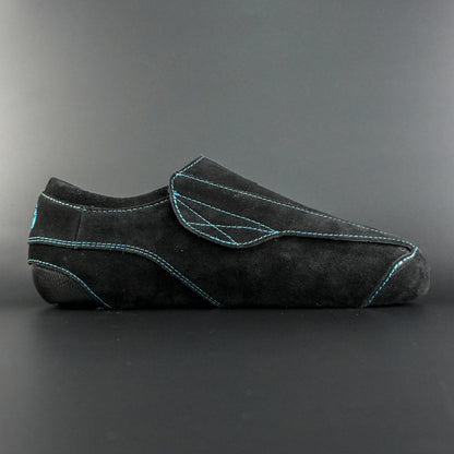 Side view of the Envy suede skate showing black suede finish