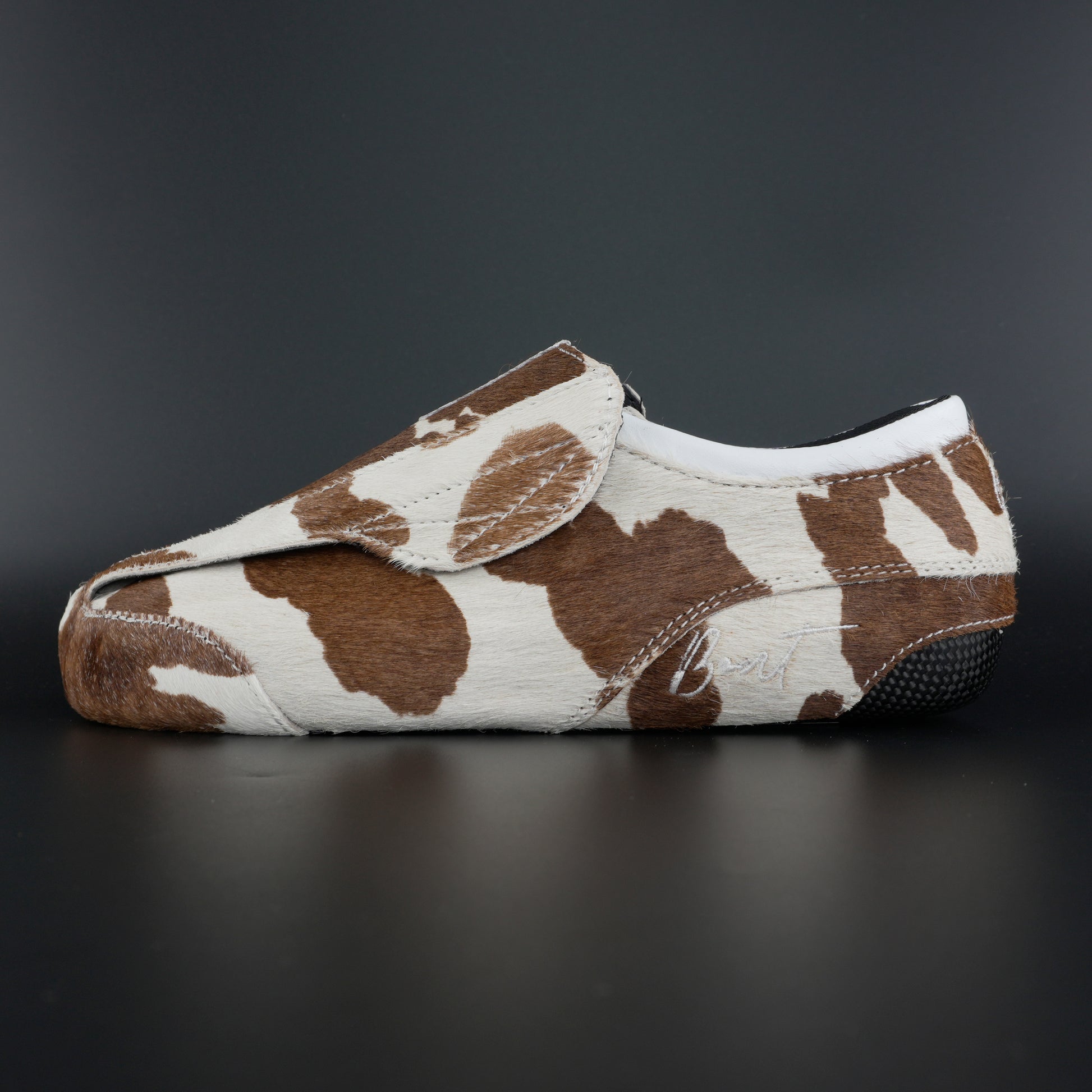 Side view of Envy Cow Skin Roller Skate showing cowhide pattern