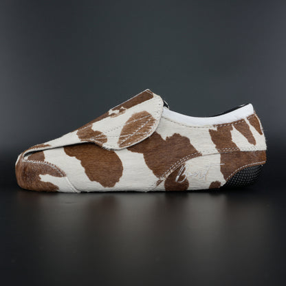 Side view of Envy Cow Skin Roller Skate showing cowhide pattern
