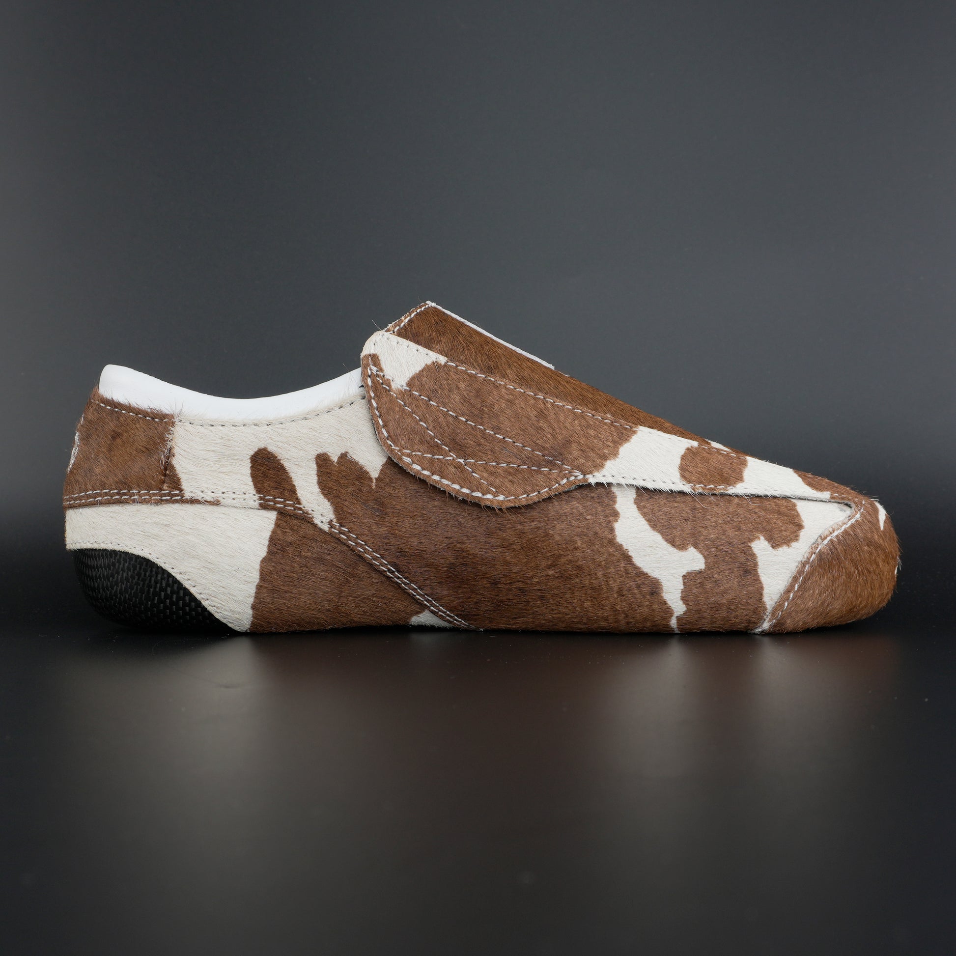 Close-up of cowhide texture and carbon base