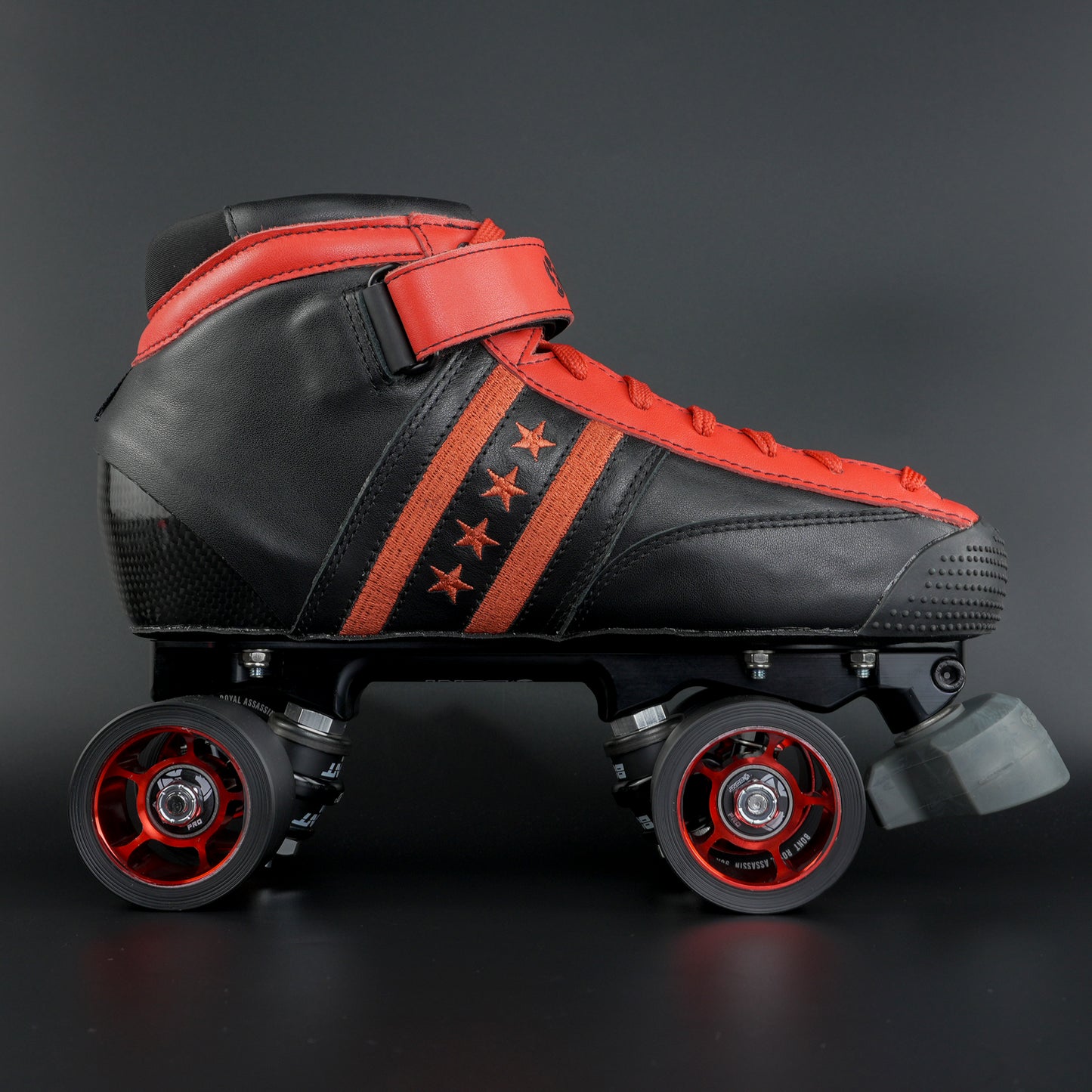 Close up showing the black boot with red trim and lacing details