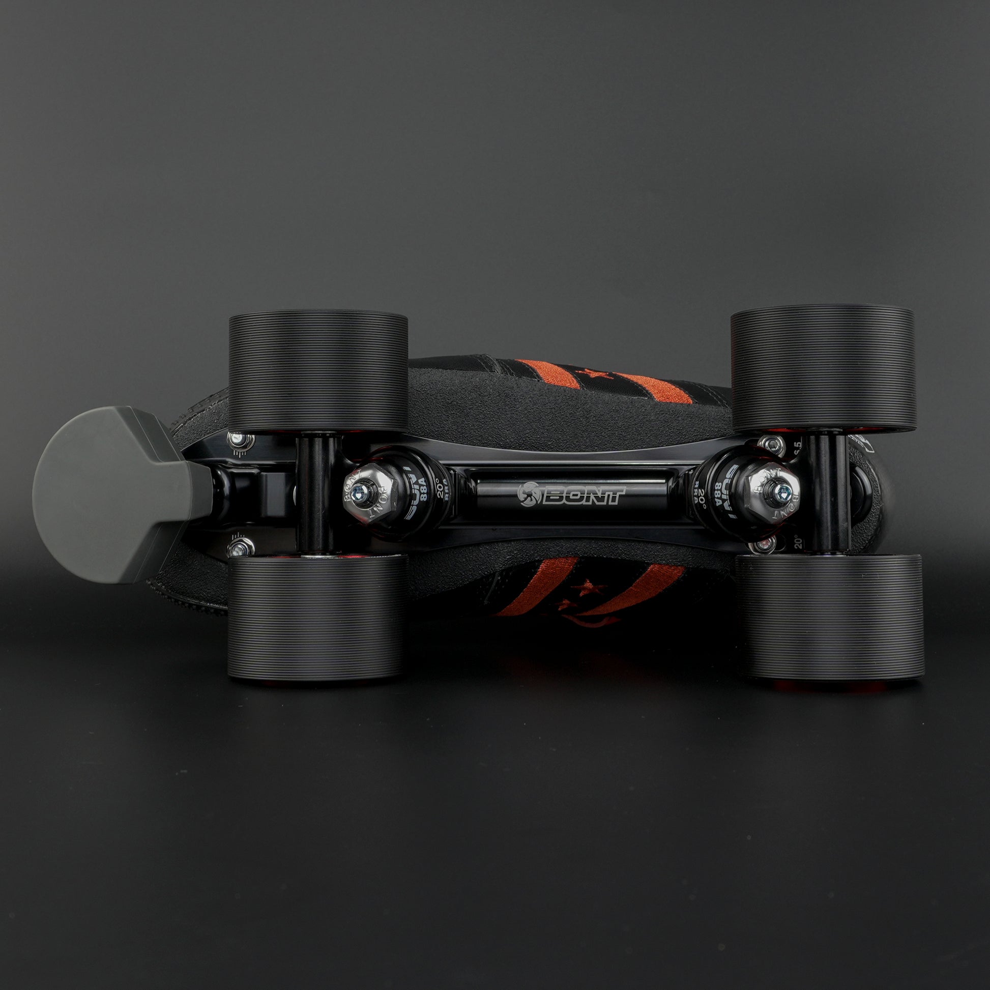 Skater wearing the black and red setup on an indoor rink during a corner