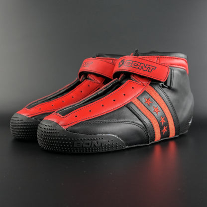 Skater wearing the black and red setup on an indoor rink during a corner